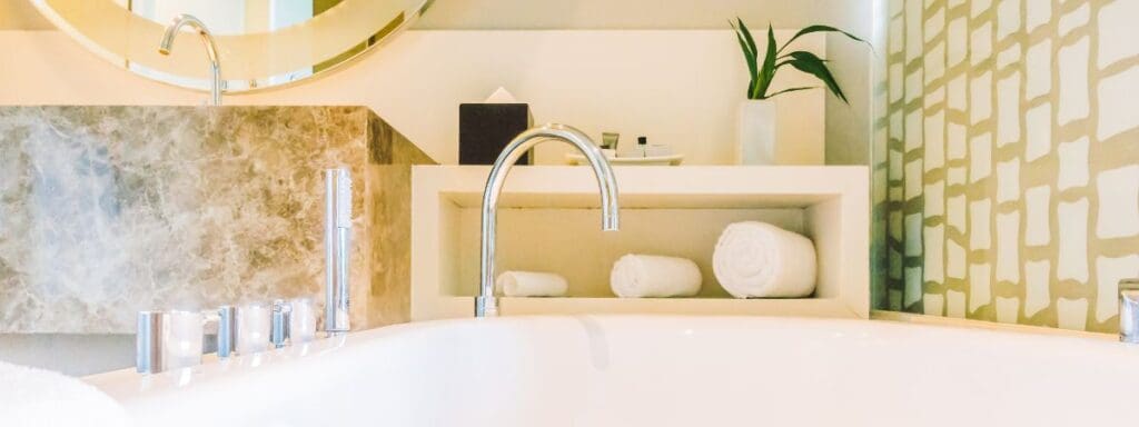 modern bathroom in a Rapid City home showing surfaces that require regular house cleaning