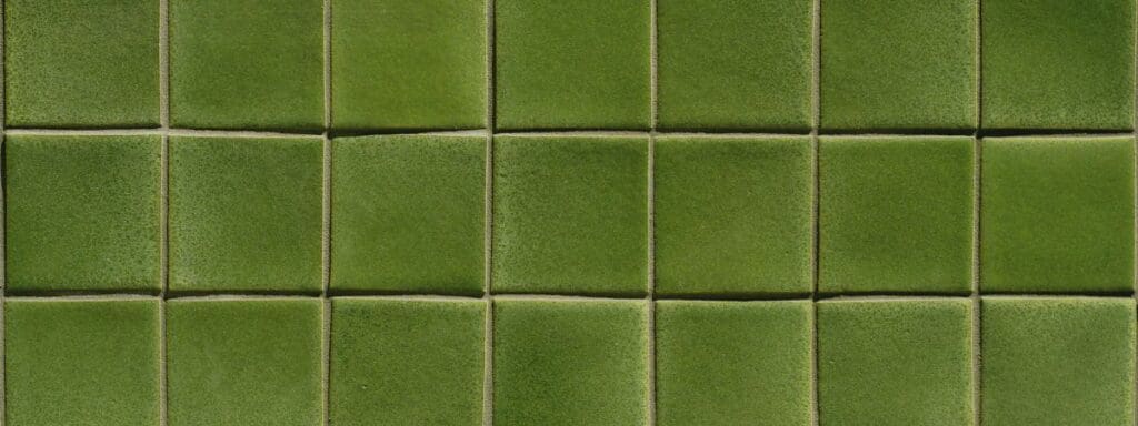 green natural tile in a Rapid City home bathroom showing a surface that requires regular house cleaning